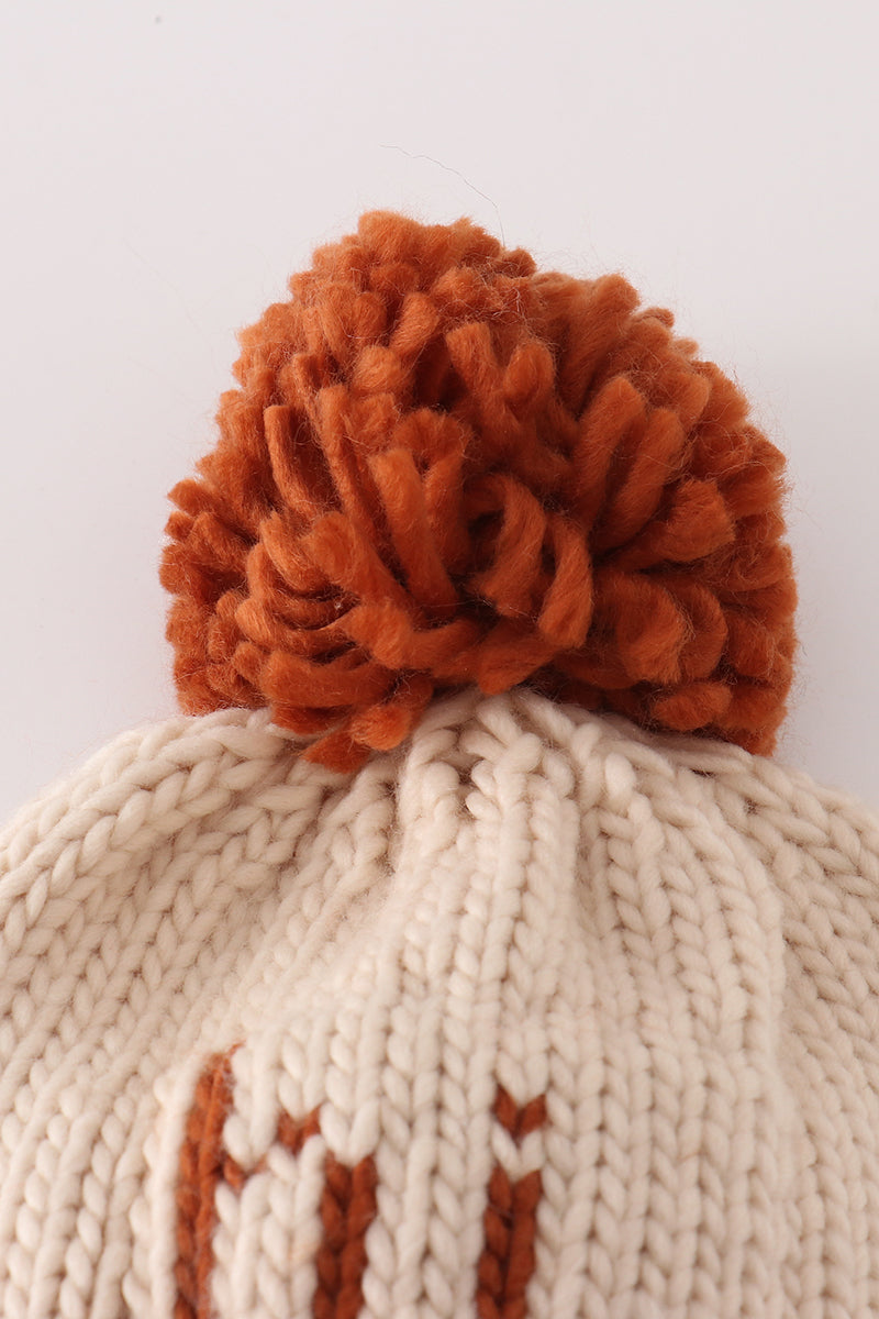 Beige pompom hi cable beanie